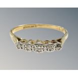 An 18ct gold and platinum five stone diamond ring, size Q1/2. CONDITION REPORT: 2.
