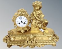 A 19th century French ornate figural ormolu mantel clock, retailed by A.