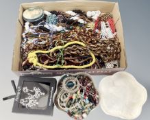 A tray containing a quantity of assorted costume jewellery, beaded necklaces,