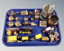 A tray containing miniature brass and copper ornaments, die cast Ringtons vans,