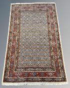 A Ghom rug, Central Iran, 126cm by 200cm.