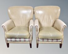 A pair of armchairs in studded beige vinyl