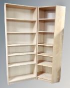 An Ikea Billy bookcase with matching corner bookcase