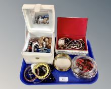 A tray containing a collection of costume jewellery including glass necklaces,