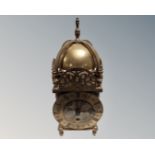 A brass lantern clock.