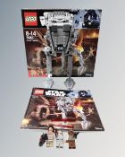 A Lego Star Wars 75153 AT-ST Walker with mini-figures box and instructions.