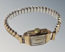 A lady's 9ct gold cased Accurist wristwatch on gilt bracelet strap.