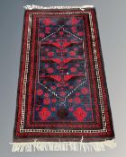 An Iranian Hamadan rug, 111cm by 188cm.