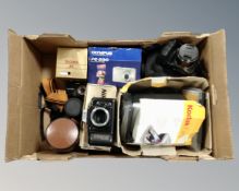 A box of Sony Cybershot digital camera in bag, boxed Nikon F-401s camera body, Kodak photo printer,