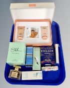 A tray containing perfumes and beauty products including Lancome Treson three piece gift set in box.