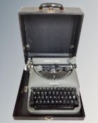 A vintage Remington Rand typewriter in case