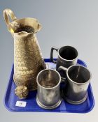 A tray containing an antique brass water jug together with a brass owl ornament and three pewter