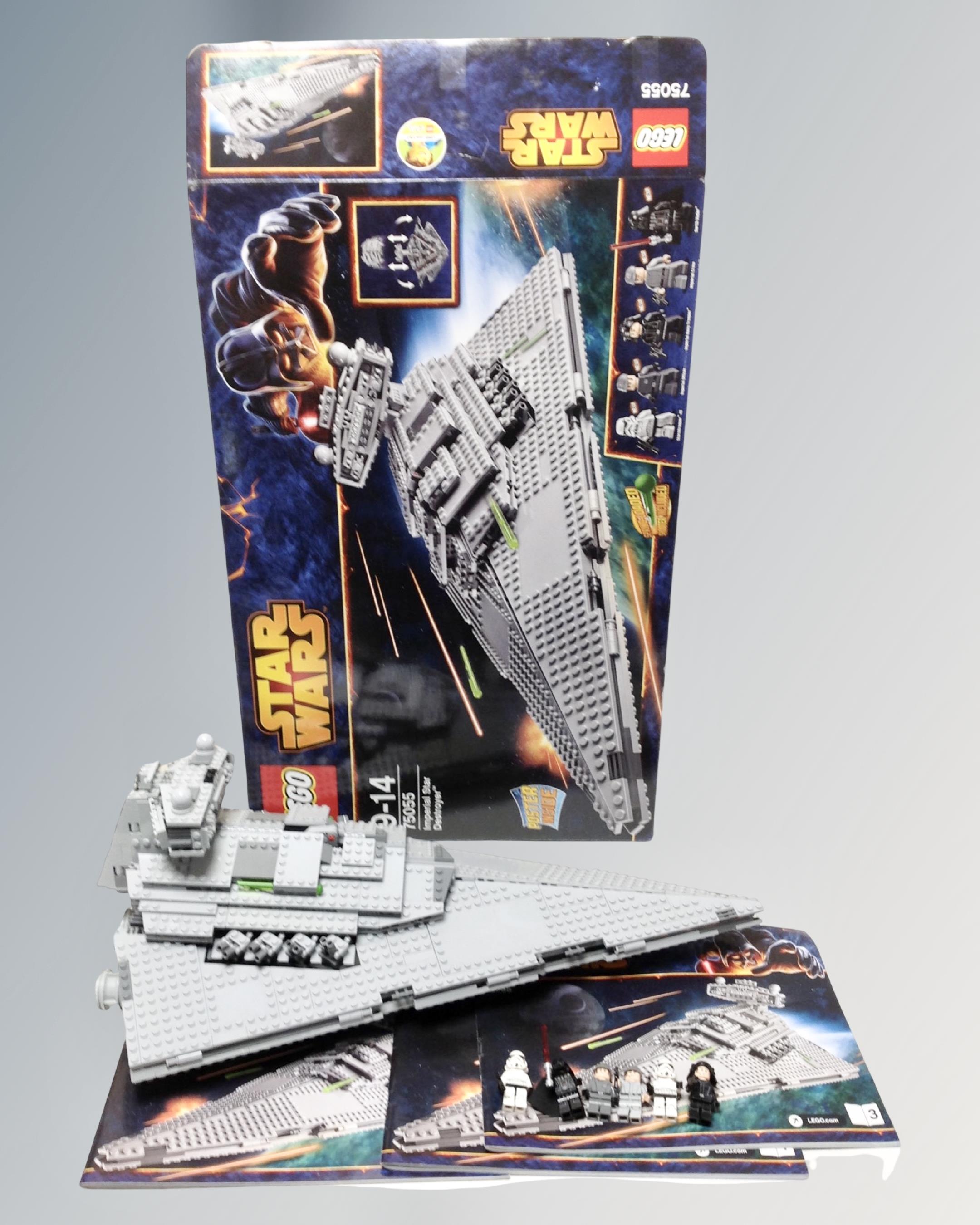 A Lego Star Wars 75055 Imperial Star Destroyer with mini-figures, box and instructions.