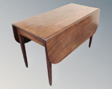 A 19th century mahogany flap sided table