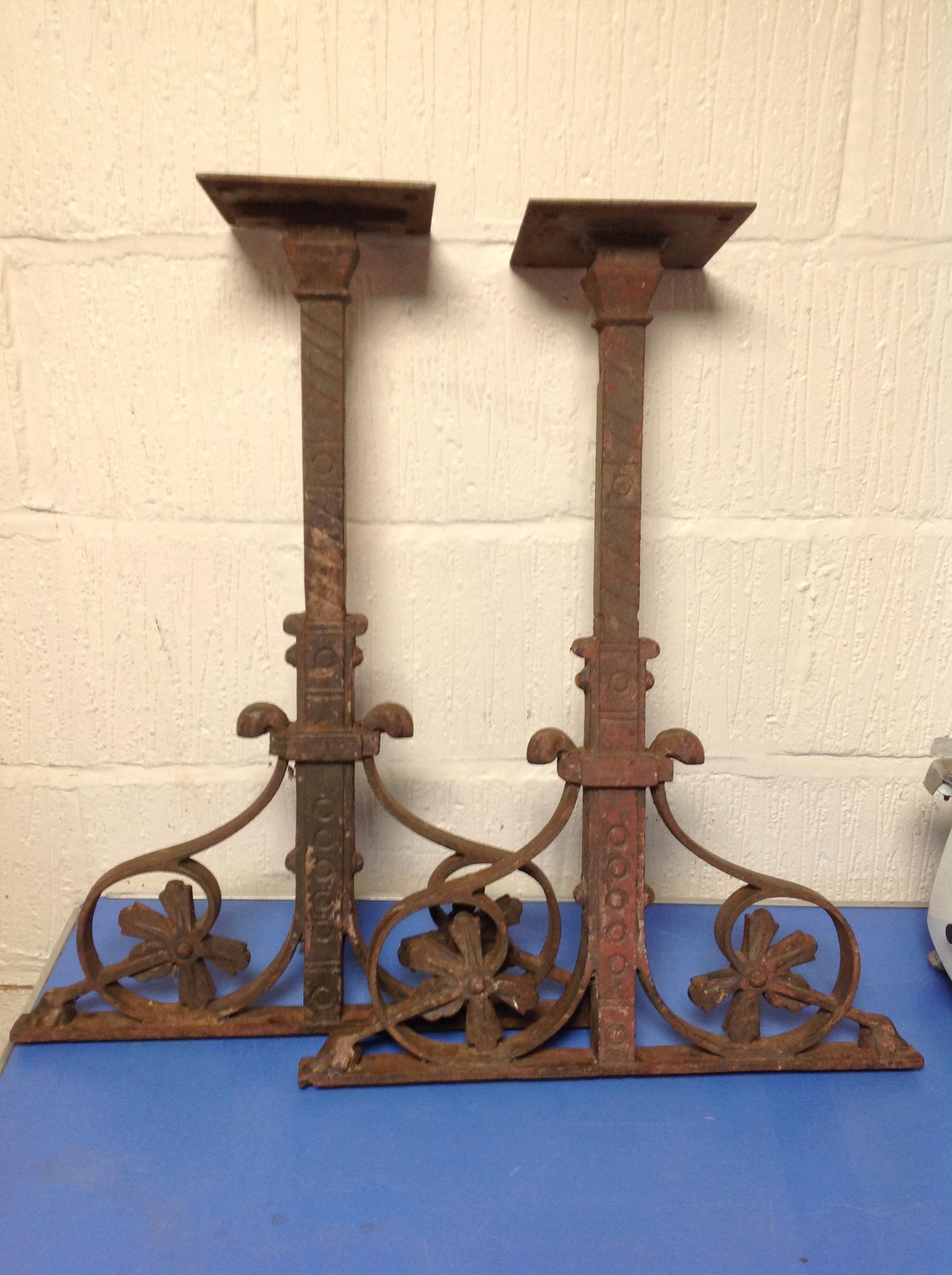 A pair of cast iron table supports