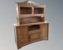 An oak Arts and Crafts buffet back sideboard