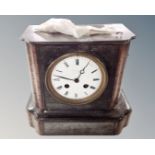 A 19th century black slate and marble mantel clock with enamelled dial.