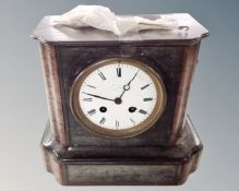 A 19th century black slate and marble mantel clock with enamelled dial.