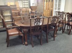 A 19th century oval mahogany wind out dining table, winder,