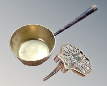A 19th century brass cast iron handled pan together with a further antique brass trivet