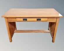 A contemporary oak Arts and Crafts style library table fitted a drawer 127 cm x 64 cm x 77 cm