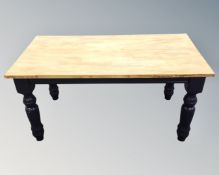 A pine farmhouse kitchen table on painted base together with a set of four high backed chairs in