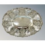 An Edwardian pierced silver dish with repoussé floral decoration, George Nathan & Ridley Hayes,