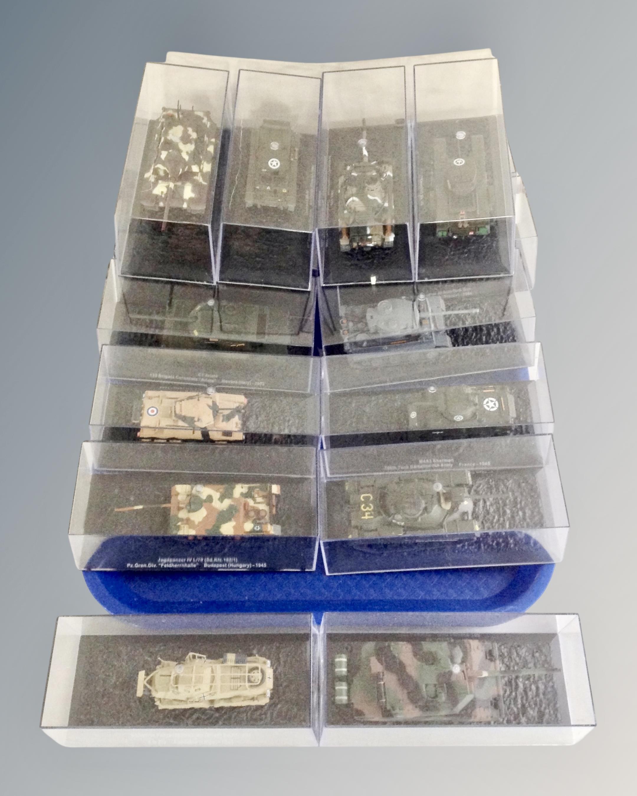 A tray of sixteen die-cast tanks / armoured vehicles