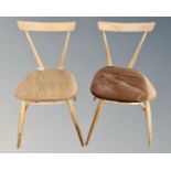 A pair of Ercol stick back stackable dining chairs