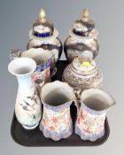 A tray of pair of transfer and gilded baluster lidded urns,