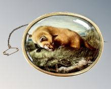 A fine 15ct gold mounted oval porcelain brooch depicting a fox and hare, width 73mm.