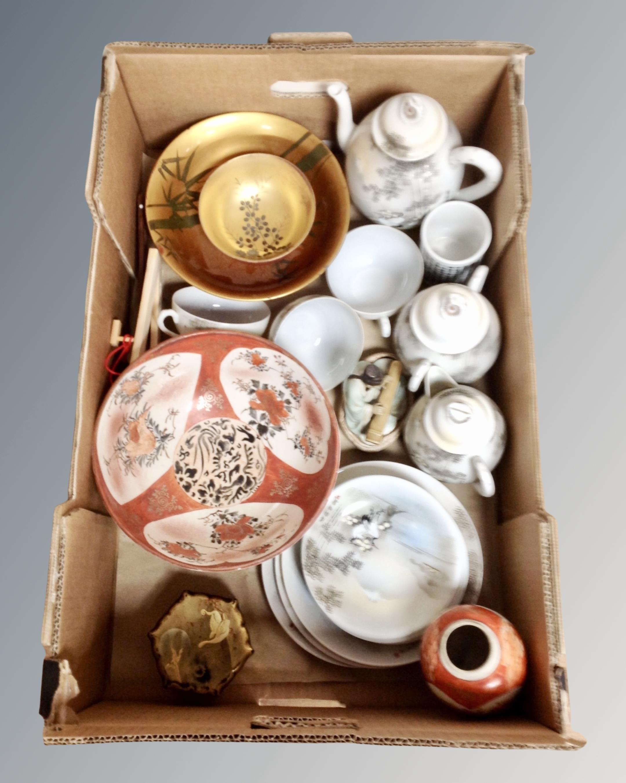 A box of Oriental ceramics, wooden table box, eggshell tea ware,
