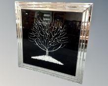 A contemporary glitter picture of a tree in mirrored frame