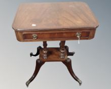 A reproduction mahogany Victorian style occasional table fitted a drawer on four way pedestal with