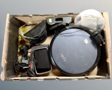 A box of Eufy Robotic vacuum with charging station, remote, Peleton glasses in case,