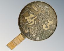 A Japanese Meiji period bronze hand mirror, length 28.5cm.