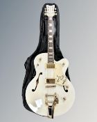 A copy of a Gretsch electric guitar in carry bag