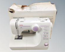A Toyota electric sewing machine with box
