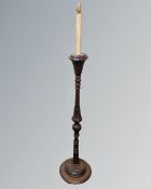 A 20th century carved beech standard lamp