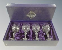 A set of four Edinburgh crystal wine glasses, boxed.