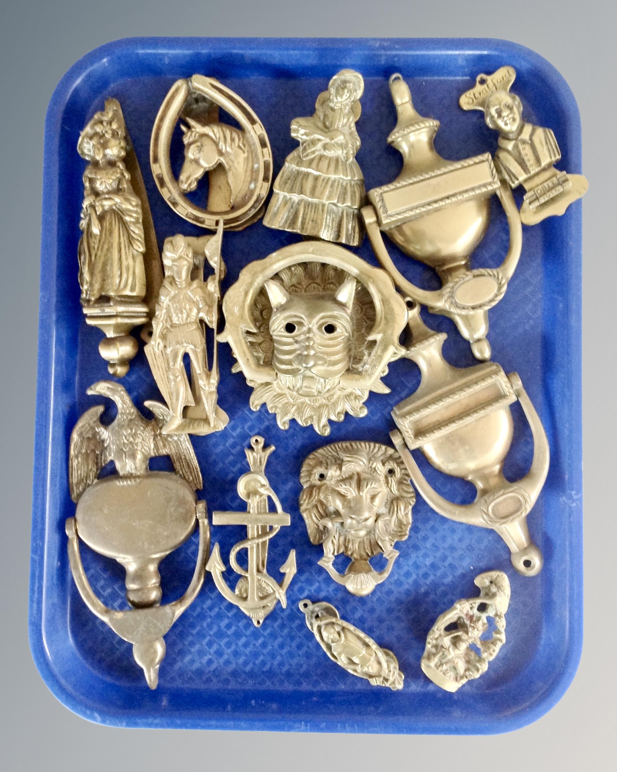 A tray of brass door knockers