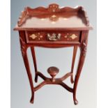 An Asian hardwood brass inlaid Regency style telephone table