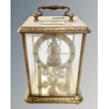A brass cased anniversary clock.