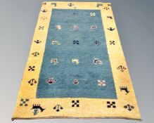 An eastern woolen rug on green and yellow ground,