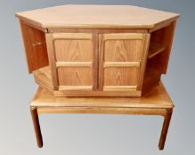 A 20th century Nathan teak corner TV stand together with a further coffee table