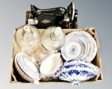 A vintage Singer sewing machine together with a box of 19th century blue and white dinner ware and