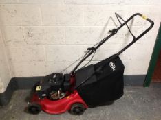 A Power Devil garden petrol lawn mower with grass box