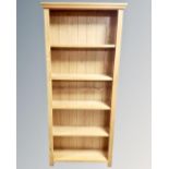 A set of contemporary oak open bookshelves