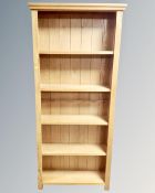 A set of contemporary oak open bookshelves