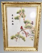 Three Chinese embroidered silk panels depicting birds, framed.
